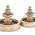 Two Multi Tiered Stone Water Fountains With Circular Basins And Decorative Design