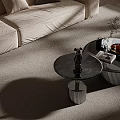Round Blue Marble Coffee Tables With Silver Ribbed Bases And Decorative Figurine Plant Fruit Plate