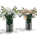 Two Clear Glass Vases Holding White and Pink Fresh Flowers with Green Stems
