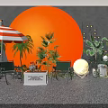 Outdoor Leisure Space With Orange Circular Background Red White Striped Umbrella Green Chairs And Plants