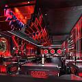 Sleek Bar Interior Featuring Red Lighting Black Decor Bar Counter And Drink Shelves