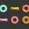 Colorful Frosted Donuts With Sprinkles And Assorted Shapes On White Surface