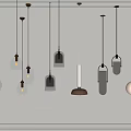 Modern Pendant Lights With Various Designs Hanging On Gray Wall For Interior Decor