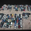 Numerous Various Colored Cars Parked In Outdoor Parking Lot With Different Models