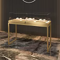Elegant Glass Display Cabinets With Golden Metal Frame Showcasing Jewelry On Marble Floor