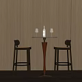 Round Bar Table With Two High Stools Against Wooden Wall And Wine Bottle With Glasses