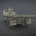 Green Military Truck with Flatbed Trailer Spare Tire on Top and Multiple Large Wheels