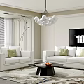 Modern White Sofa and Black Coffee Table Set With Green Pillows in Living Room