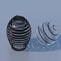 Decorative Ornament Set With Black Striped Lantern And Clear Spiral Glass Ball On Light Background