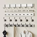 Decorative Wall Hooks With Various Designs For Hanging Coats And Bags On Beige Wall
