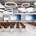 Modern Conference Room Interior With Rows Of Chairs Large Screens And Circular Ceiling Lights