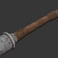 Ancient Weapon with Worn Metal Head and Textured Wooden Handle