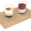 Layered Desserts in Two Glasses on Wooden Tray with Cream and Berries