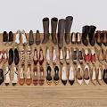 Various Styles And Colors Of Shoes Neatly Arranged On Wooden Floor