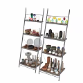 Two Grey Ladder Shelves Displaying Various Colored Shaped Ceramic Vessels On Dark Wall