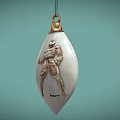 Silver Teardrop Shaped Jewelry Pendant With Carved Figure And Gold Top Accent