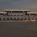 Modern Gas Station With Illuminated Canopy And Petrol Pumps At Evening Time