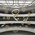 Hanging Art Installation With Golden Circular Rings And Wire Mesh Spheres In Indoor Space