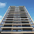 Tall Modern Residential Building With Multiple Floors Balconies And Blue Sky Background