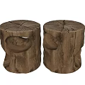 Two Rustic Wooden Tree Stump Shaped Stools With Natural Texture And Holes