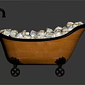 Orange Bathtub With Black Trim Faucet And Wheels Filled With White And Gold Packets