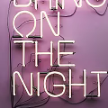 Neon Decorative Light with ON THE NIGHT Text on Purple Background