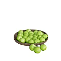 Green Fruits Filled in Wooden Plate with Some Scattered Around