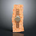 Gold Watch With Circular Dial Placed On Orange Textured Decorative Surface