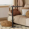 Pink Round Functional Table Next to Sofa With Cup Saucer on Top and Stuffed Toy