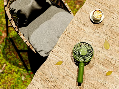 Outdoor Table with Wicker Chair Gray Cushion Small Green Fan and Coffee in Natural Setting 3d model