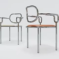 Two Modern Leisure Chairs With Chrome Frame Curved Armrests And Light Orange Leather Seats