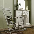 Wooden Accent Chair With Patterned Pillow By Light Green Wall White Fireplace And Green Plant