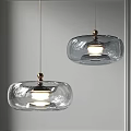 Modern Transparent Glass Pendant Lights With Metal Details And Illuminated Design