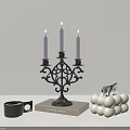Black Metal Candelabra With Three Purple Candles Ornate Design On Book