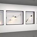 Modern Wall Lamps Displayed in White Cases with Various Designs and Lighting Effects