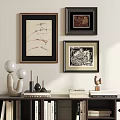 Framed Abstract Paintings Displayed on Wall with Decorative Books Lamps and Sculpture