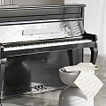 Black Upright Piano and Artistic Drawing Supplies with Scrolls and Papers