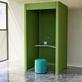 Green Sofa Booth Interior With Blue Round Stool And Small Table