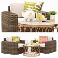 Outdoor Wicker Sofa With Green Beige Cushions Metal Coffee Table Teapot Lemonade And Plant