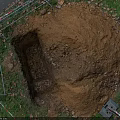 Road Infrastructure Construction Site With Excavated Pit Scaffolding And Grass Surroundings On Dirt Ground