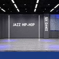 IME Modern Fitness Studio With Blue Lighting Gray Walls And Wooden Floor