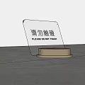 Transparent Acrylic Sign With Golden Base Displaying Please Do Not Touch Text