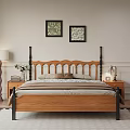 Cozy Wooden Double Bed with Black Metal Headboard Brown Comforter Nightstands Lamps and Wall Art