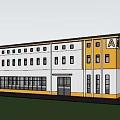 Modern Industrial Factory Building With Yellow Gray Exterior And Large Windows On Green Lawn