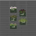 Hanging Basket Plants with Various Greenery Mounted on Gray Brick Wall