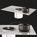 Modern Kitchen Appliances Featuring Sleek Stove Range Hood And Black Cookware Emitting Steam
