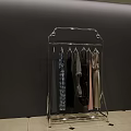Metal Clothes Rack with Hanging Clothes for Store Display in Modern Indoor Setting