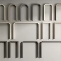Various Stylish Door Arches In Light And Dark Gray Displayed On White Wall