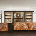 Modern Bar Counter With Orange Marble Top Shelves With Bottles And Green Plants