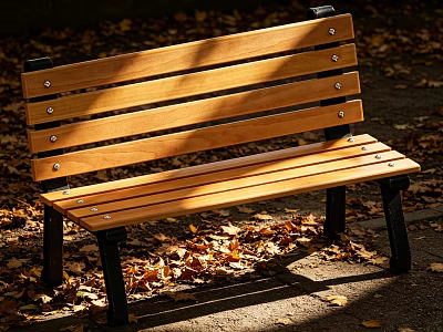 Wooden Public Bench With Metal Legs Surrounded By Autumn Leaves In Sunlight 3d model